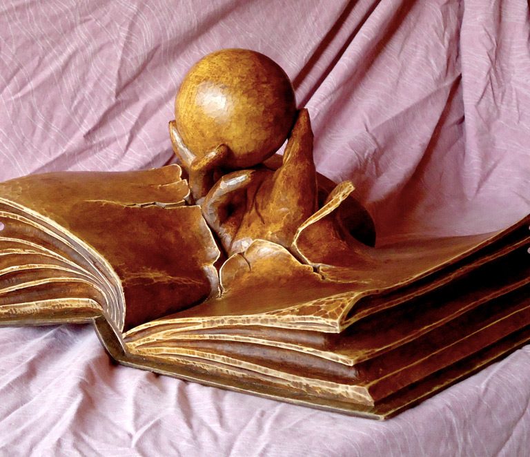 sculpture livre : main qui sort d'un livre BM