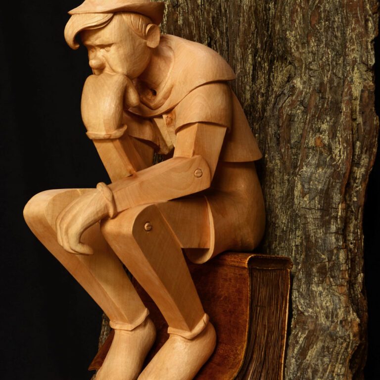 Sculpture bois d'un Pinocchio penseur